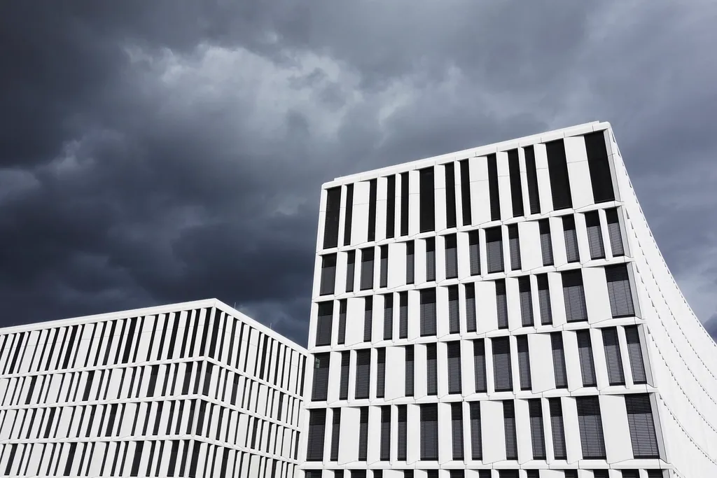 Modern office buildings under a cloudy sky